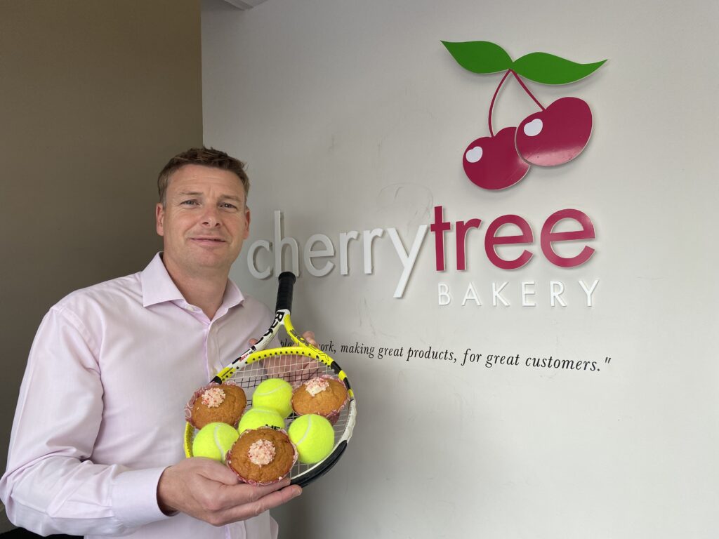 Mark Beaumont, MD, with the Wimbledon-inspired strawberries & cream muffins.